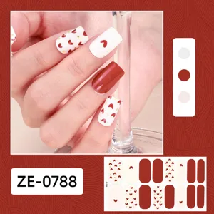 Detailed view of Valentine's day heart nail wrap stickers, featuring red and white designs.