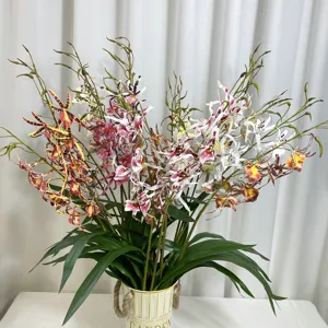 Artificial spider orchid flower arrangement in bucket, realistic silk floral decor for home.