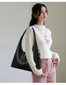 Stylish slouchy leather shoulder bag for women, elegant commuter large tote and hobo handbag.