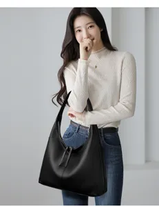 Detail view of the elegant black leather hobo shoulder bag, perfect for daily commuting.