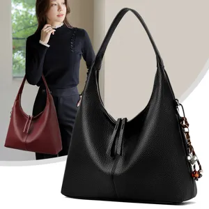 Genuine leather shoulder bag for women, elegant hobo tote bag with casual cowhide pattern design.