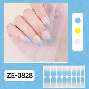 Detail view of blue gradient nail wrap sticker featuring delicate yellow floral motifs.