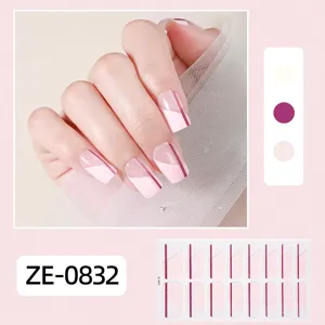 Detail view of pink gradient geometric nail wrap sticker, stylish DIY manicure detail shot.