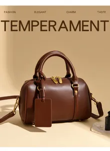 Stylish brown leather boston bag for women, chic small pillow crossbody bag with top handle.