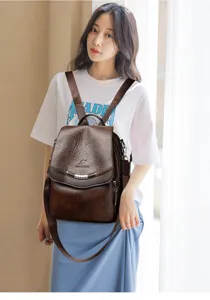 Vintage brown leather backpack for women, multi-functional casual daypack and school bag.