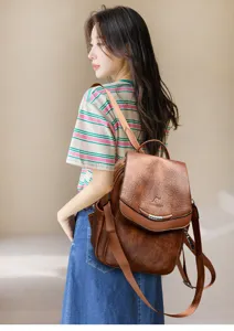 Vintage brown leather backpack for women, multi-functional casual school bookbag stylish.