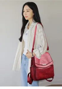 Vintage red leather backpack for women, multi-functional casual school travel daypack.