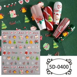 Detailed display of 5D embossed Christmas nail art stickers with cute bears and bow designs.