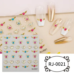 5D embossed heart wing nail art stickers, shiny gold foil DIY crystal gemstone manicure decals.