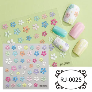 Close-up detail of colorful 5D floral nail art stickers featuring sparkling rhinestone crystals.