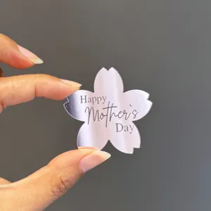 Detailed view of acrylic cherry blossom cake topper for Mother's Day celebration party decor.