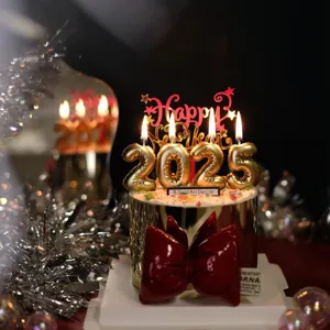 New Year cake topper set with 2025 number candles and acrylic Happy New Year sign.