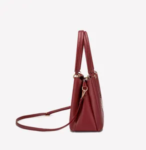 Elegant burgundy litchi pattern leather tote bag with top handles and adjustable shoulder strap.