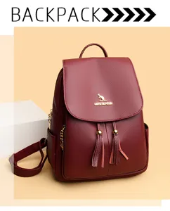 Women's wine red leather backpack with stylish tassels, metal hardware and secure flap closure.