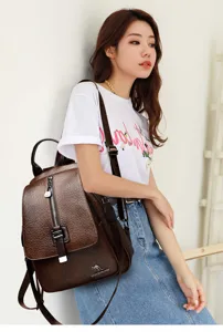 Detail view of women's retro oil wax leather backpack with multi-pocket design and secure style.