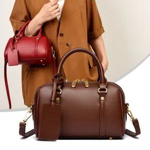 Stylish solid color leather small Boston bag, classic pillow handbag, chic crossbody bag.