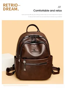 Detail view of retro brown oil wax leather women backpack with metal kangaroo logo and multi zip pockets.