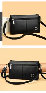Classica borsa a tracolla nera in vera pelle con doppia cerniera e design elegante per donna.