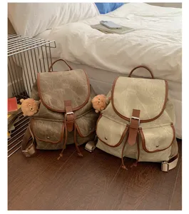Korean style vintage casual canvas backpack with double pockets and cute bear charm for daily.