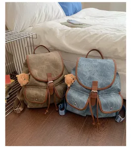 Detailed view of the casual canvas dual-pocket drawstring backpack in a cozy bedroom setting.