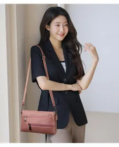 Elegante borsa a tracolla da donna in ecopelle con tasche multiple per uso quotidiano ideale.
