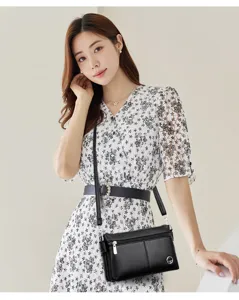 Borsa a tracolla nera in vera pelle da donna, elegante custodia per telefono e borsa.