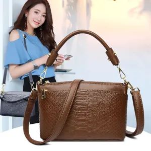 Brown crocodile textured leather shoulder bag for women, chic top handle crossbody purse.