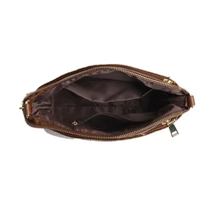 Brown crocodile pattern leather women handbag interior structure top view display bag.