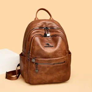 Vintage oil wax leather backpack for women, stylish brown travel school daypack with multi pockets.