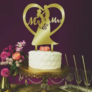 Gold acrylic Mr Mrs wedding cake topper engagement party decoration close-up detail shot