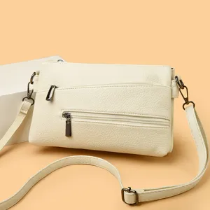 Elegante borsa a tracolla bianca con texture in pelle, comode tasche con zip per donne.