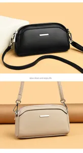 Detailed close-up of the stylish leather crossbody phone bag, showing fine texture and hardware.