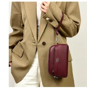 Genuine leather wrist phone bag for women, stylish double layer clutch with metal heart.