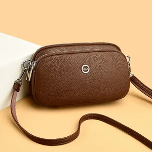 Stylish leather multi-compartment mobile phone shoulder bag for women daily casual use.