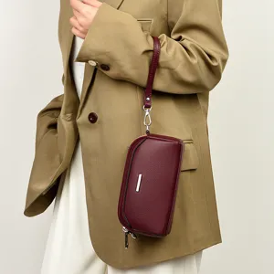 Stylish cowhide texture women phone bag clutch shoulder bag with wrist strap and silver bar.
