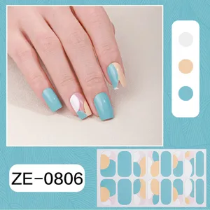Detail view of abstract geometric nail wraps featuring blue, beige and pink color blocks for spring.