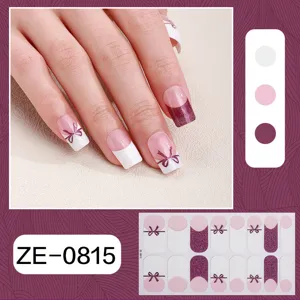 Detailed view of french bow nail wrap stickers featuring glitter wine red and pink elegant design.