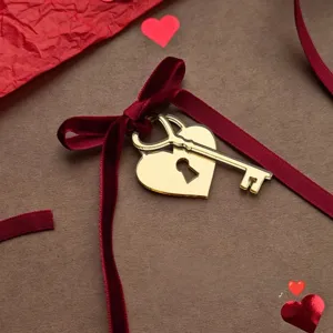 Valentine's Day heart lock key cake topper with red velvet ribbon for romantic party decor.