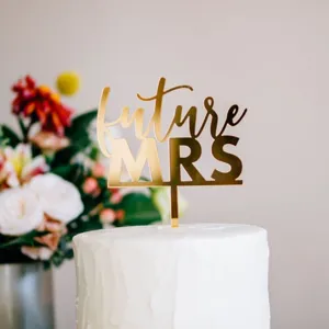 Gold acrylic future mrs cake topper detail shot, perfect wedding party decoration accessory.