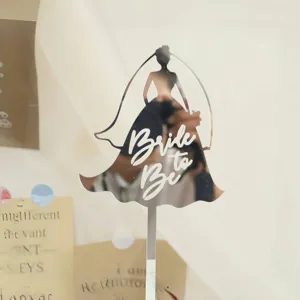 Detail shot of mirror acrylic bride to be cake topper, perfect for bridal shower party decor.