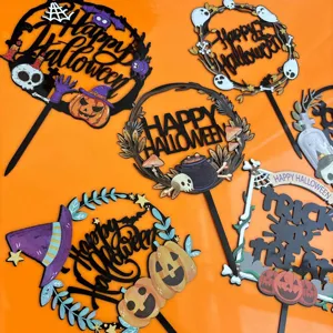 Detailed shot of Halloween cake toppers with spooky pumpkin and ghost designs for party decor.