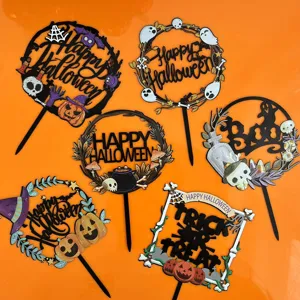 Close up of acrylic Halloween cake toppers featuring cute ghost and pumpkin spooky designs.