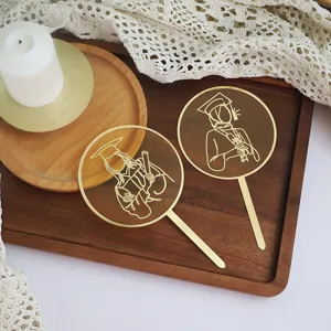 Graduation acrylic cake topper set with gold line design, perfect for graduation party decor.