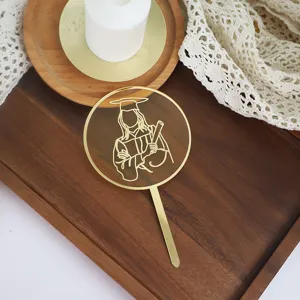 Gold acrylic graduation cake topper, line art PhD graduate silhouette decoration for party.