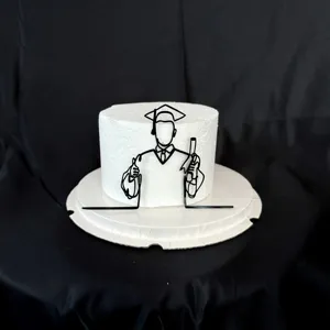 Detailed view of black acrylic graduation cake topper, ideal for graduation party decor.