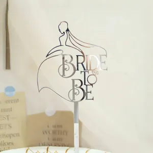 Silver acrylic bride to be cake topper detail, elegant wedding party decoration close-up