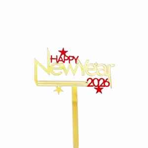 Close-up detail view of the 2026 New Year acrylic cake topper with gold and red accents.