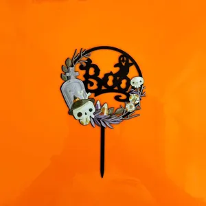 Halloween acrylic cake topper detail with spooky skull and ghost design for party decor.