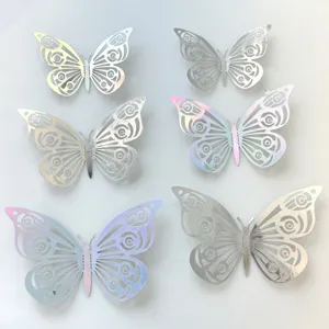 Hollow paper butterfly cake toppers set, iridescent metallic party decor for birthdays.