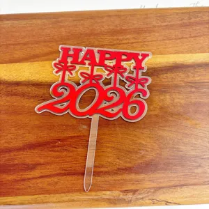 Close-up detail shot of 2026 New Year acrylic cake topper in red for party dessert decor.